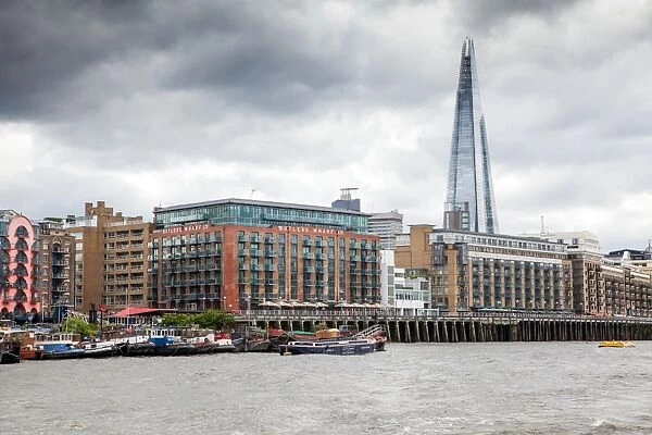 Butlers Wharf and the Shard seen from the River Thames, London, England, United Kingdom