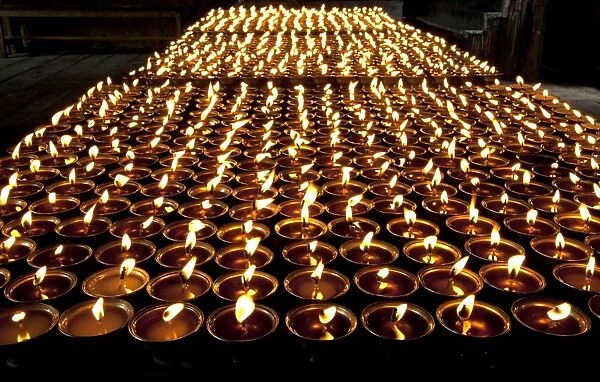 Butter lamps lit in Mongar Dzong (monastery), built in the 1930s, one of Bhutans newest dzongs