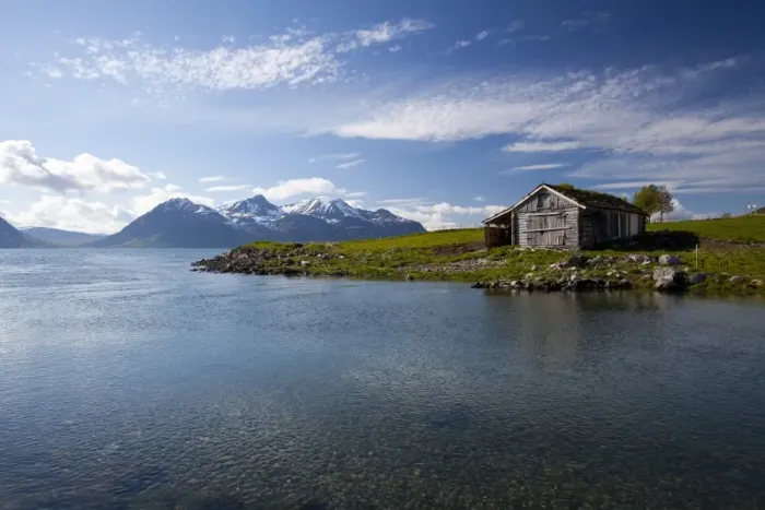 Framed Print : Cabin with traditional grass roof overlooking a fjord and snowy mountains in Lyngen Peninsula Framed Print : Cabin with traditional grass roof overlooking a fjord and snowy mountains in Lyngen Peninsula