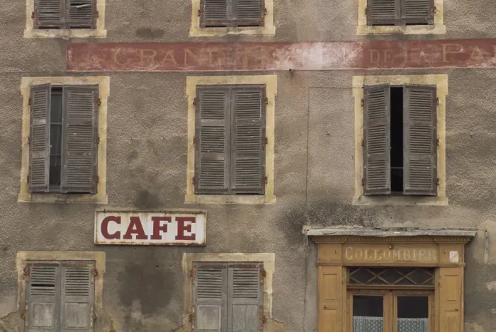 Framed Print : Cafe sign on the outside of an old hotel building with wooden shutters at Mauriac in the Auvergne Framed Print : Cafe sign on the outside of an old hotel building with wooden shutters at Mauriac in the Auvergne