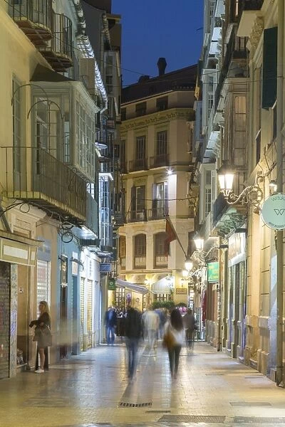 Cafes and restaurants on Calle Granada at dusk, Malaga, Costa del Sol, Andalusia