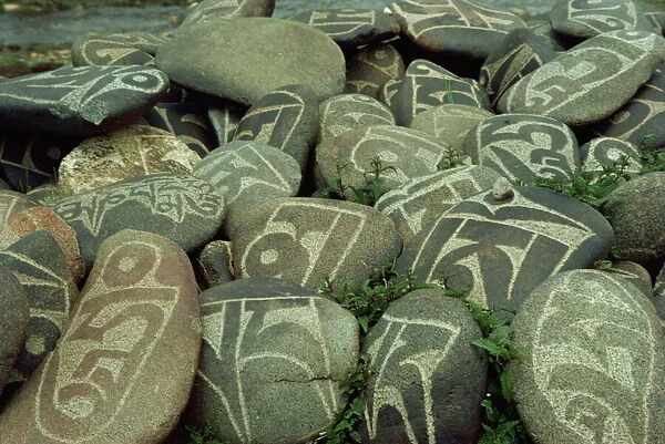 Cairn of individual prayers carved on stones, Tibet, China, Asia