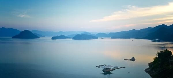 A calm view of southeast Qiandao Lake in Zhejiang province at dusk, Zhejiang, China, Asia