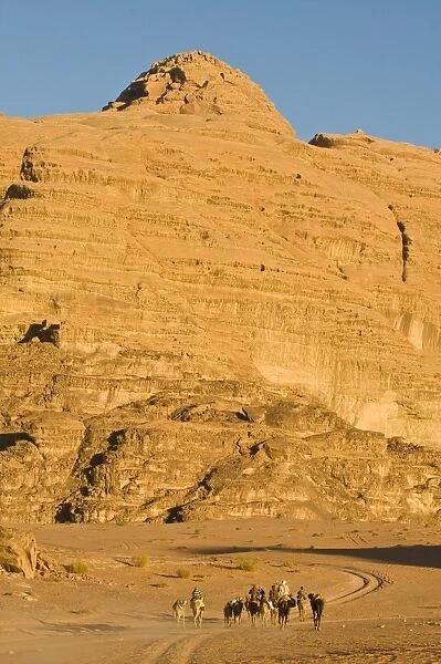 Camel caravan in the stunning desert scenery of Wadi Rum, Jordan, Middle East