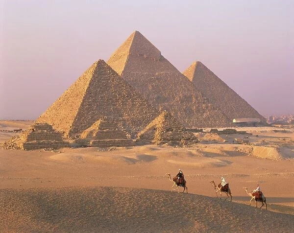 Camel riders at Giza Pyramids, UNESCO World Heritage Site, Giza, Cairo