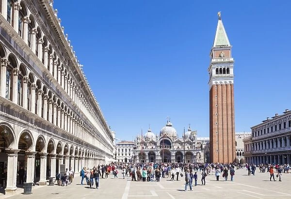 Campanile tower, Piazza San Marco (St. Marks Square) with tourists and Basilica di San Marco