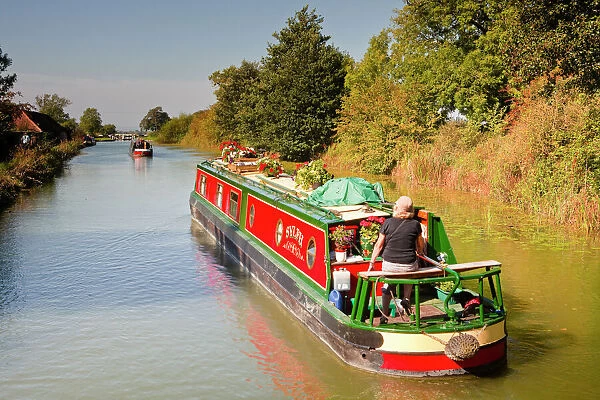 Canal boats idling their way down the Kennet and Avon Canal, Wiltshire, England, United Kingdom, Europe