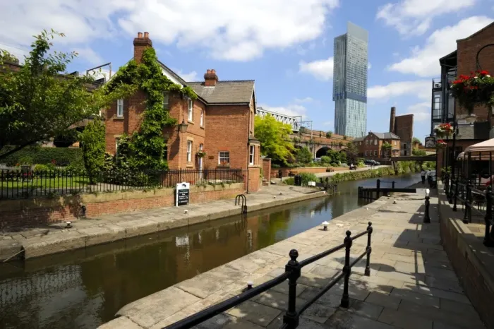 Framed Print : Canal and lock keepers cottage at Castlefield with the Beetham Tower in the background Framed Print : Canal and lock keepers cottage at Castlefield with the Beetham Tower in the background