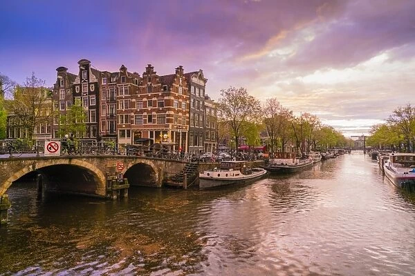 Canal scene at dusk, Amsterdam, Netherlands, Europe