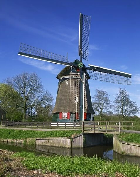 Canal and thatched windmill at Edam, Holland, Europe