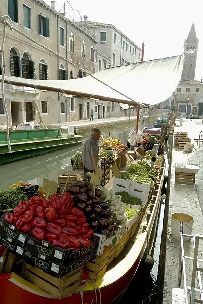 Canalside vegetable market stall