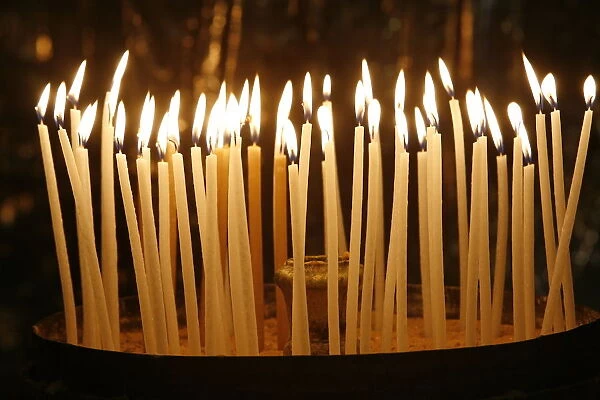 Candles in the Church of the Holy Sepulchre, Jerusalem, Israel, Middle East