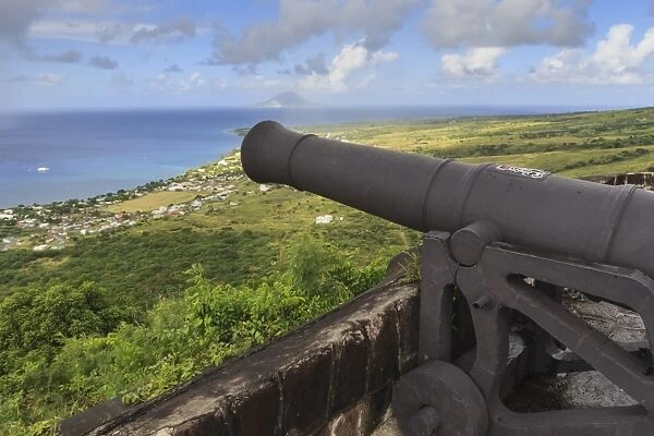 Cannon points towards the sea, with St. Eustatius in the distance, Brimstone Hill Fortress, UNESCO World Heritage Site, St. Kitts, St. Kitts and Nevis, West Indies, Caribbean, Central America