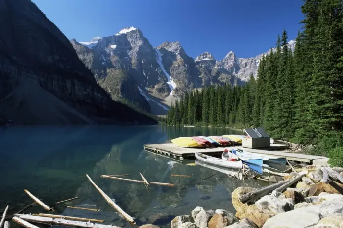 Framed Print : Canoes for hire on shore of Moraine Lake, with view to the Wenkchemna Peaks Framed Print : Canoes for hire on shore of Moraine Lake, with view to the Wenkchemna Peaks