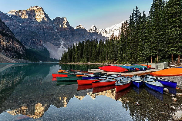 Canoes at sunrise at Lake Moraine, Banff National Park, UNESCO World Heritage Site, Alberta, Rocky Mountains, Canada, North America