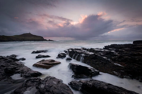 Cape Cornwall, as seen from Kenidjack Valley at sunset with stormy sky, Cornwall, England