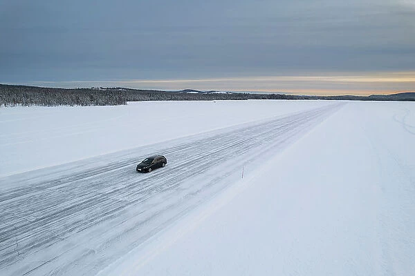 Car on icy road on a frozen lake from above, aerial view, Lapland, Sweden, Scandinavia, Europe