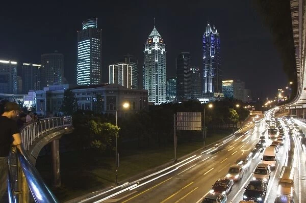 Car light trails and illuminated buildings on Peoples Square, Shanghai, China, Asia