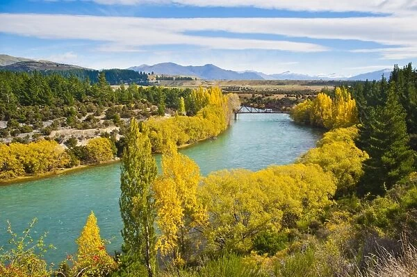 Caravan crossing a bridge on the Clutha River in autumn, Wanaka, South Island, New Zealand, Pacific