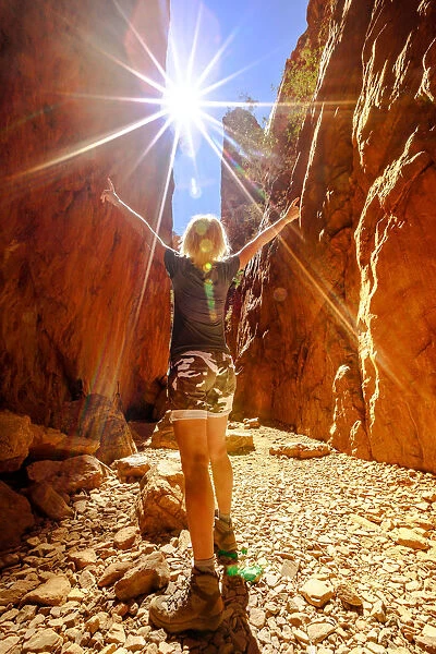 Carefree tourist woman enjoying the picturesque natural alleyway of Standley Chasm