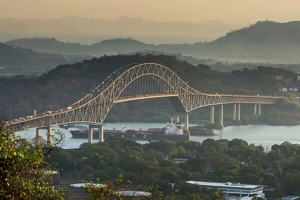 Cargo boat passes the Bridge of the Americas on the Panama Canal, Panama City, Panama