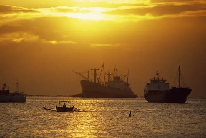 Framed Print : Cargo ships and outrigger canoe in Manila Bay at sunset Framed Print : Cargo ships and outrigger canoe in Manila Bay at sunset