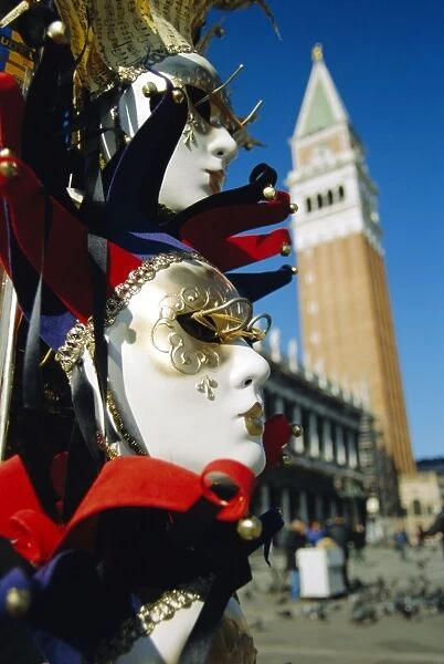 Carnival masks on souvenir stand and Campanile