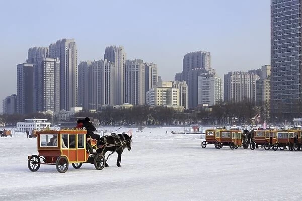 A carriage on the icebound Songhua River in Harbin, Heilongjiang, China, Asia