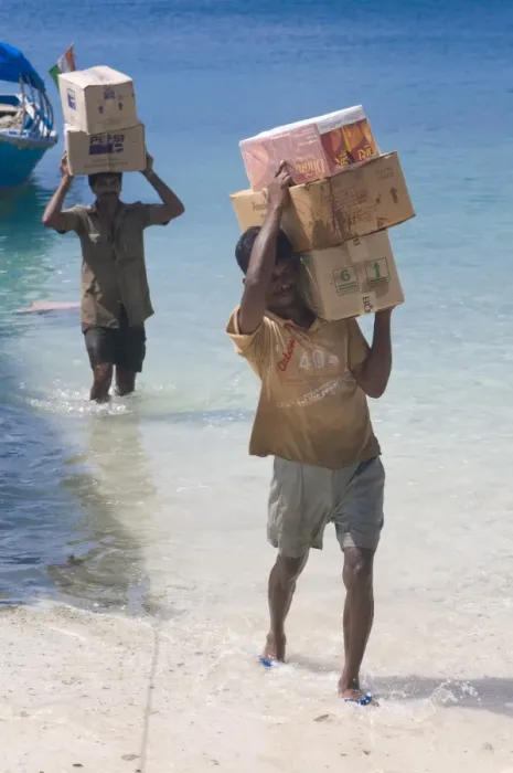 Framed Print : Carriers carrying huge boxes out from a boat, Havelock Island, Andaman Islands Framed Print : Carriers carrying huge boxes out from a boat, Havelock Island, Andaman Islands