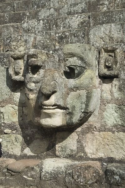 Carved stone face on the steps of the East Court, Copan Archaeological Park