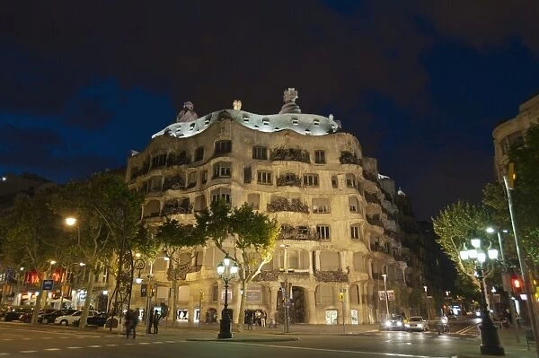 Casa Mila (La Pedrera), by Antoni Gaudi at dusk, Passeig de Gracia, Barcelona