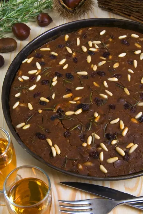 Framed Print : Castagnaccio, pie of chestnut flour with raisins, rosemary and pine nuts Framed Print : Castagnaccio, pie of chestnut flour with raisins, rosemary and pine nuts