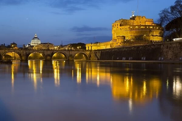 Castel Sant Angelo and St. Peters Basilica from the River Tiber at night, Rome, Lazio