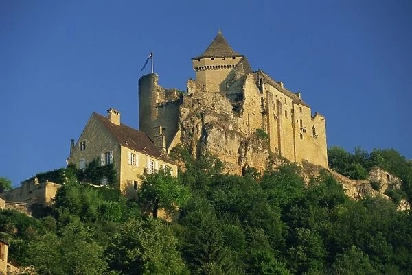 Castle perched on hill above the Dordogne River at Castelnaud in the Dordogne