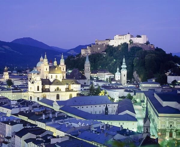 The cathedral and fortress illuminated at night in the town of Salzburg