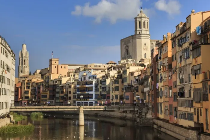 Framed Print : Cathedral towers above distinctive historic colourful arcaded houses and Onyar River Framed Print : Cathedral towers above distinctive historic colourful arcaded houses and Onyar River