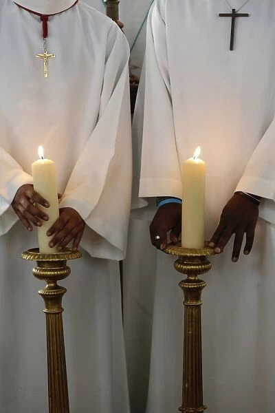 Catholic altar boys holding church candles, Seine-Saint-Denis, France, Europe