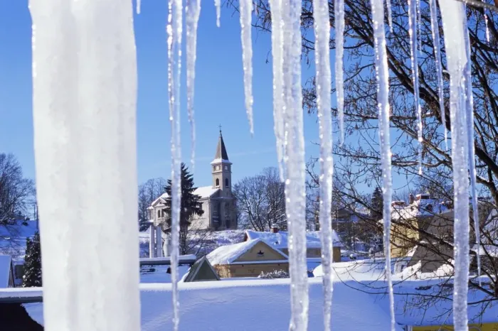 Framed Print : Catholic church in village of Luceny nad Nisou, Jizerske mountains, seen through icicles Framed Print : Catholic church in village of Luceny nad Nisou, Jizerske mountains, seen through icicles
