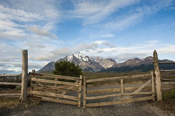 Cattle gate with the towers of the Torres del Paine National Park in background, Patagonia, Chile, South America