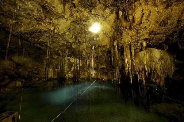 Cenote Dzitnup, underground sinkholes which has only one natural source of light
