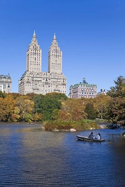 Central Park and the Grand buildings along Central Park West viewed across the lake in autumn