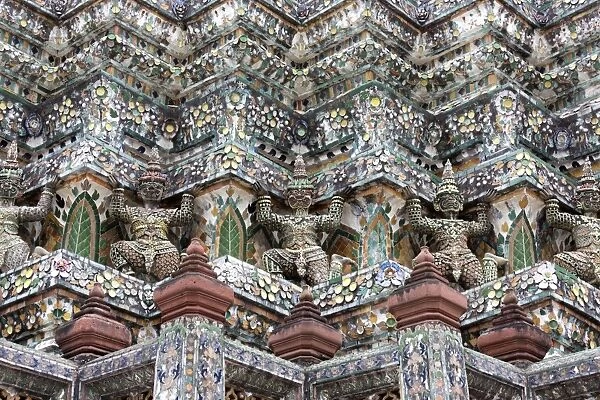Detail of the Central Prang showing demon figures and ceramic decoration created using broken ceramics used as ballast in the 19th century on Chinese trading ships, Wat Arun, Bangkok, Thailand, Southeast Asia, Asia
