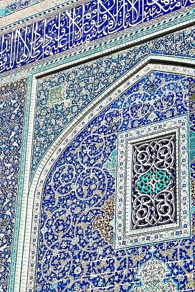 Detail of ceramic tiles on wall in Isfahan blue, Imam Mosque, UNESCO World Heritage Site
