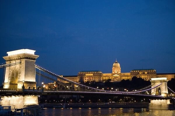 Chain Bridge over Danube with Royal Palace beyond in the evening