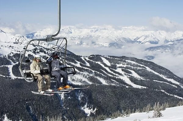 Chairlift with skiers, Whistler mountain resort, venue of the 2010 Winter Olympic Games