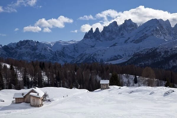 Chalets around San Pellegrino Pass and Pale di San Martino range in the background