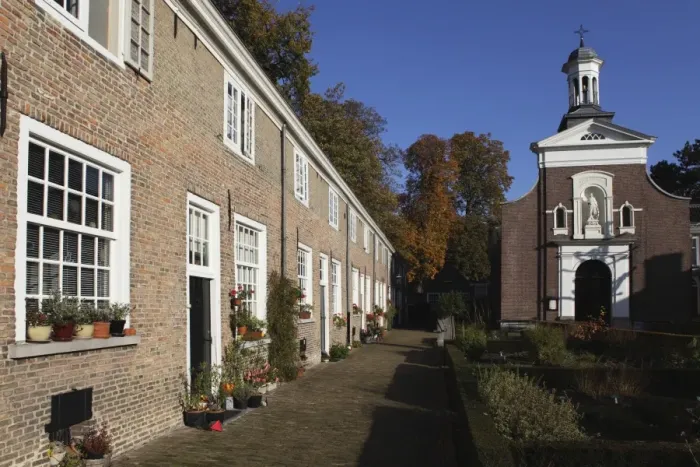 Framed Print : Chapel and brick housing within the courtyard of the Begijnhof (Beguinage) in Breda Framed Print : Chapel and brick housing within the courtyard of the Begijnhof (Beguinage) in Breda