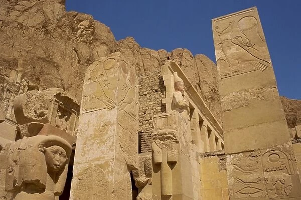 Detail from the Chapel of Hathor, where Hathors face forms the capitals on the square pillars