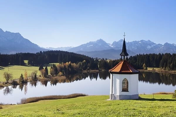 Chapel at Hergratsrieder See lake with Allgau Alps, near Fussen, Allgau, Ostallgau, Bavaria, Germany, Europe