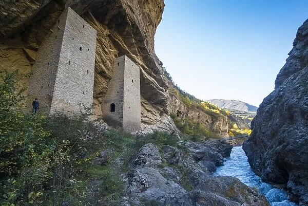 Chechen watchtowers in an overhanging cliff on the Argun River, near Irum Kale. Chechnya, Caucasus, Russia, Europe